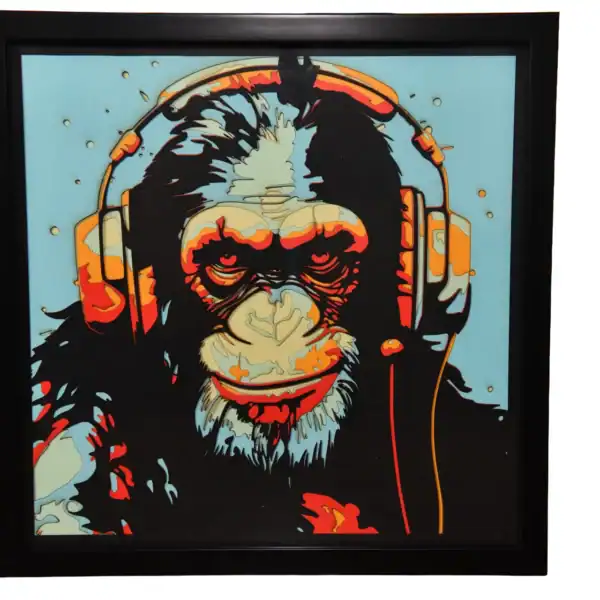 Tableau décoratif en papier multicouches représentant un singe DJ stylisé avec casque audio, fabriqué en atelier à Genève